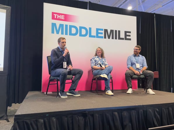 Adam Bryant, Jennifer Mitchell, and Tanner Morley participate in a fireside chat at Home Delivery World 2025.